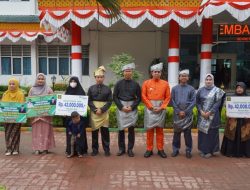 Pj Bupati Langkat Pimpin Upacara HUT ke-275  Langkat: Dorong Kinerja ASN dan Bagikan Santunan